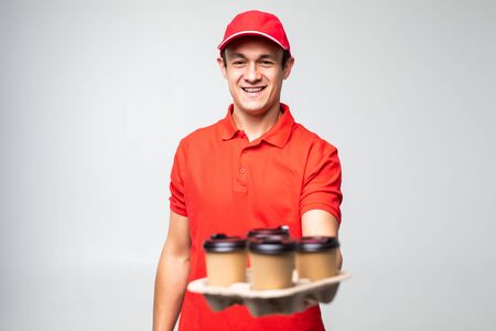 Handsome worker of food delivery service on white backgroundの写真素材