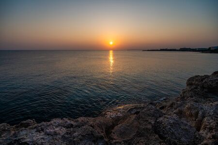 Ayia Napa, Cyprus with beautiful love rock bridge on mediterranean sea at sunsetの写真素材