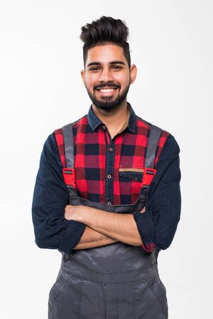 Portrait of smiling worker in blue uniform isolated on white backgroundの写真素材