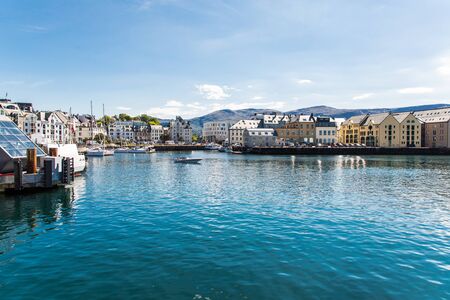 Alesund, Norway - June 2019: View of colorful Art Nouveau architecture in the port of the city of Alesund, Norway.の写真素材