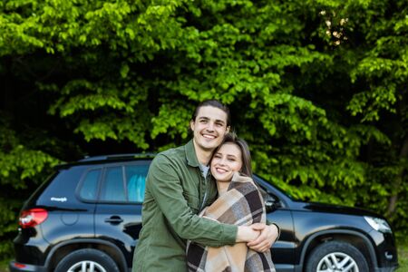 Beautiful young couple have a good time in the forest at daytime.の写真素材