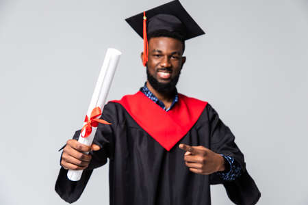 Excited graduation african man isolated on white backgroundの写真素材