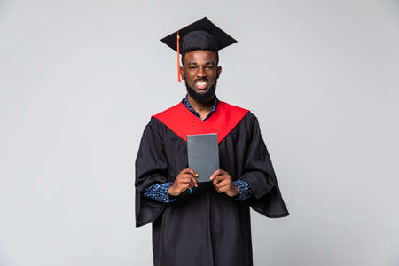 Excited graduation african man isolated on white backgroundの写真素材