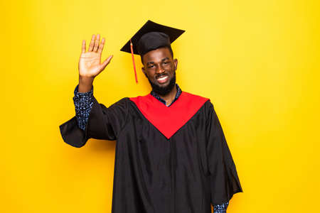Excited graduation african man isolated on white background