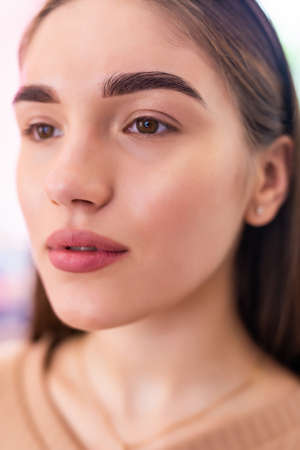 Make-up artist woman eyebrows close up. Professional makeup and skin care.