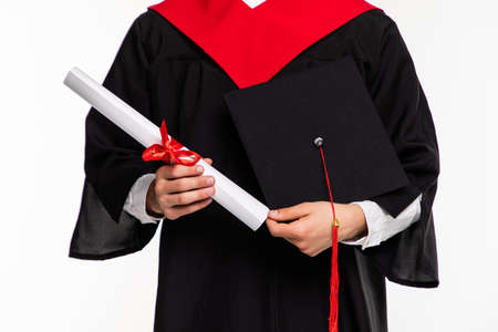 Cheerful young graduated student man isolated on whiteの写真素材