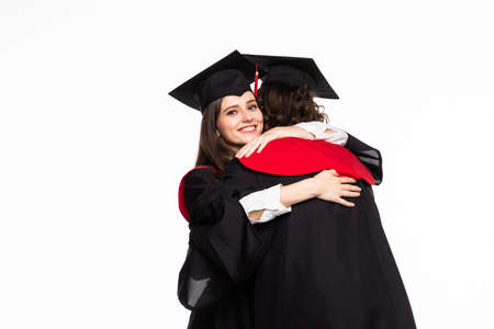Happy graduated young students couple huggingの写真素材