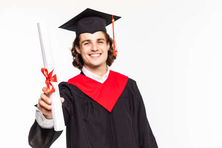 Portrait of a man in graduation robes holding a diplomaの写真素材