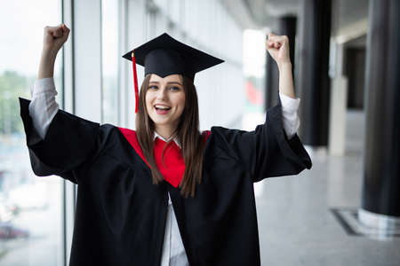 Portrait happy woman on her graduation day University. Education and people.の写真素材
