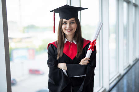 Portrait happy woman on her graduation day University. Education and people.の写真素材