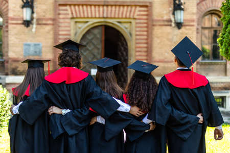 back view of college students with cap and gown celebrate graduationの販売画像