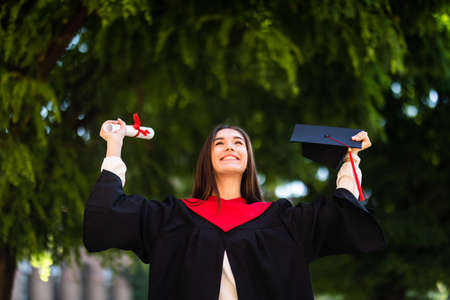 Woman portrait on her graduation day. University. Education, graduation and people concept.の写真素材