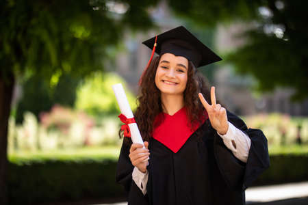 Woman portrait on her graduation day. University.の写真素材