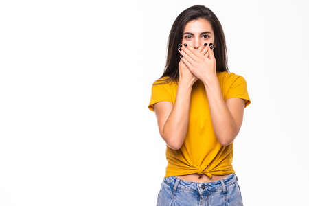 Surprised woman covering with hands her mouth