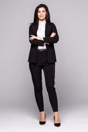 Full length Business woman confident smile standing and cross her arms isolated on whiteの写真素材