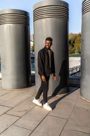 Portrait of black man very happy, smiling in urban backgroundの写真素材