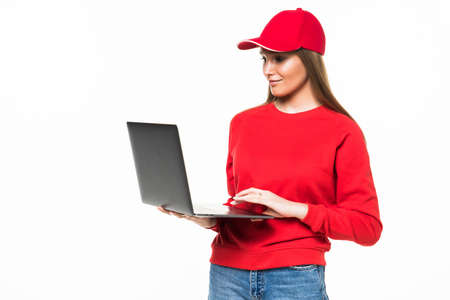 Delivery employee woman in red cap blank t-shirt uniform protect face mask gloves work courier...