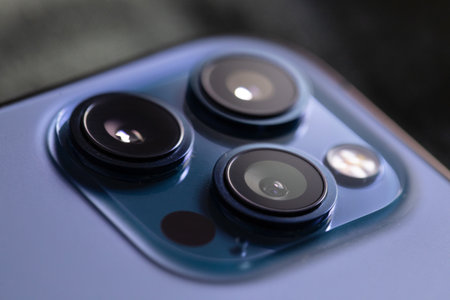 Close up photo of modern smartphone's triple-lens camera