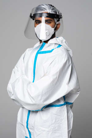 Portrait of man doctor in protective clothes during pandemic. Epidemic, pandemic of. Doctor, patient in respirator.の写真素材