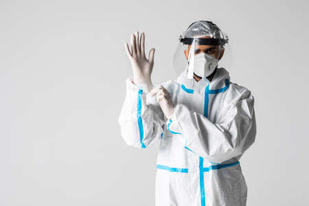 Man With Intense Expression Wearing HAZMAT Protective Clothing Isolated On A White Background.