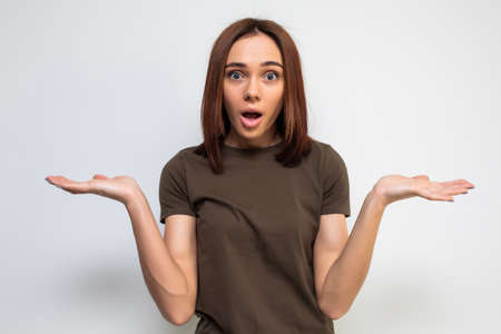 unsure woman with shrug and hands out gesturing uncertainty