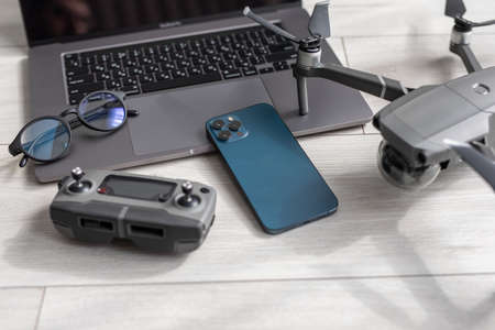 Drone, notebook, smartphone and laptop, camera and glasses Top view.の写真素材