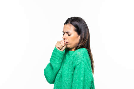 Young sick woman fell ill and coughing isolated on white backgroundの写真素材