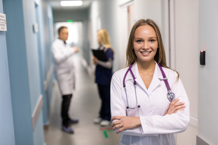 Attractive female doctor in front of medical groupの写真素材