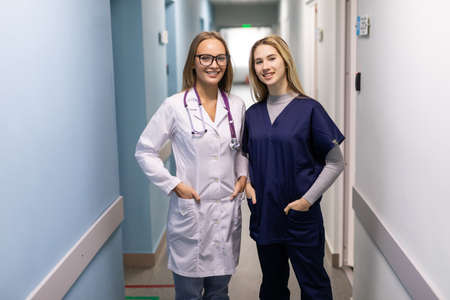 Medical staff have a meet in hospital corridorの写真素材