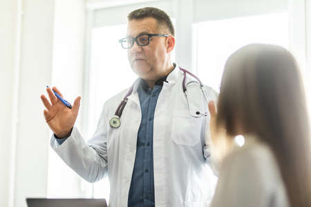 Doctors presenting results in medical seminar to medical teamの写真素材