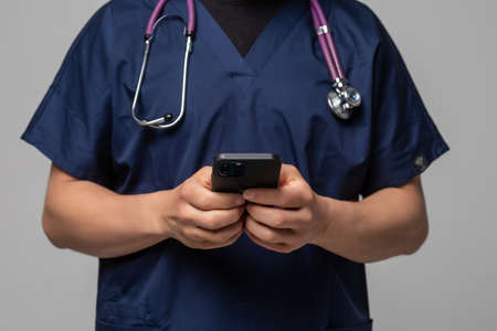doctor using mobile phone close up view isolated on white background