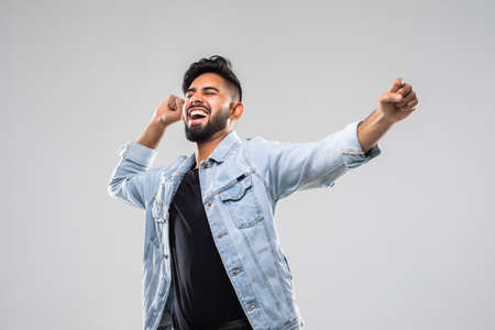 Successful man with arms open isolated over white backgroundの写真素材