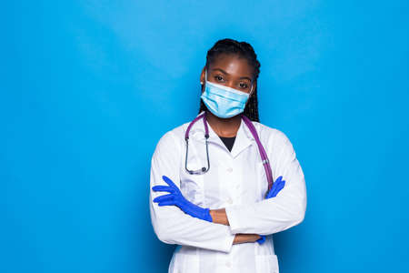 Smiling confident female healthcare professional with lab coat on white background. Patient office visit, health care plan management conceptの写真素材
