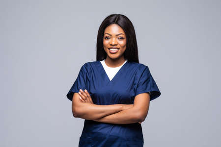 Female African American doctor or nurse smiling isolated over white background