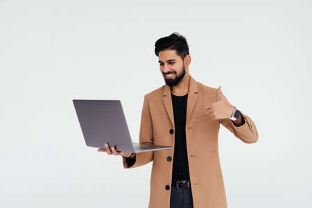 handsome business man with laptop on white background