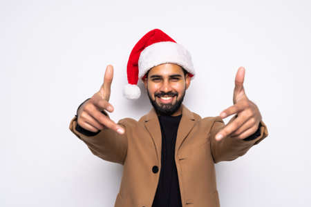 Christmas Concept - Handsome Business man wear santa hat showing thumb up on white isolated background.の写真素材
