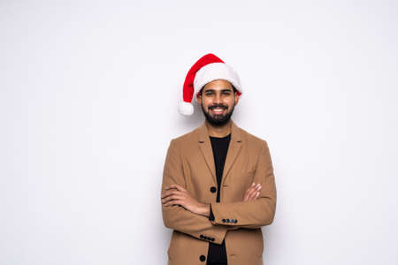 Smiling christmas man wearing a santa hat isolated on the white background