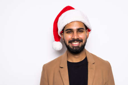 Young man wearing christmas hat for santa on white backgroundの写真素材