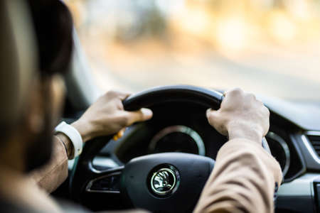 Young man sitting in a car