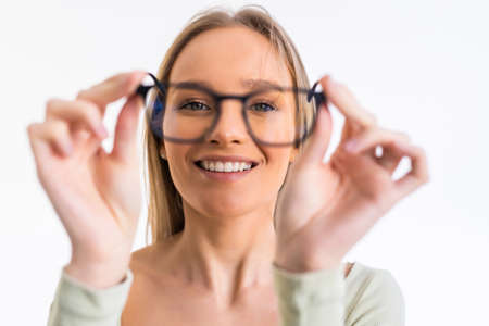 Beautiful young woman wearing glasses close-up. isolated on white background.