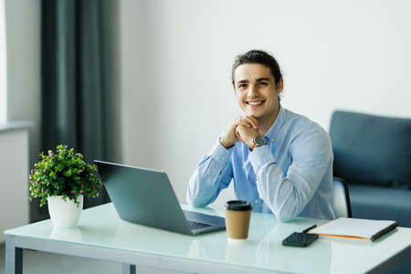 young man working on laptop