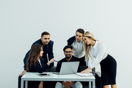 Group of business people brainstorming together in the meeting room