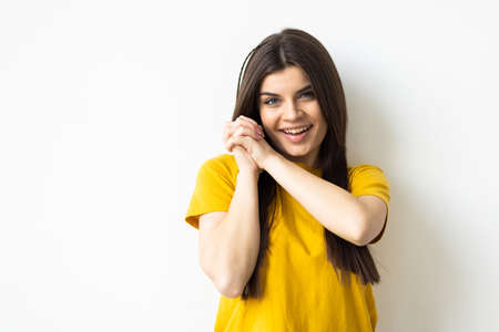 Happy woman isolated on gray studio backgroundの写真素材