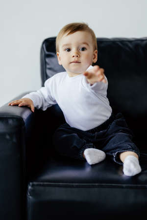 Little boy using video chat on sofa, view from web camera