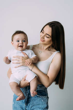young mother with her son over white backgroundの写真素材