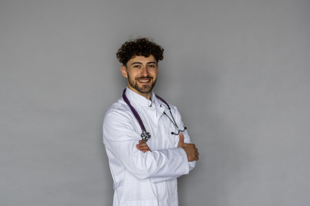 Portrait of male doctor isolated on gray backgroundの写真素材