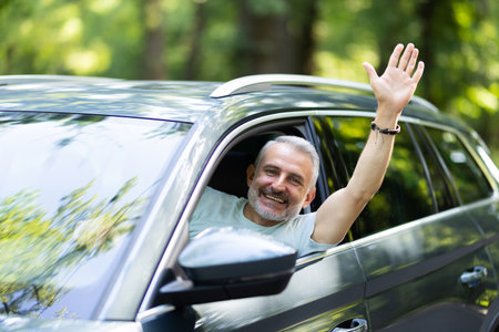 Adult man in a traffic jam, loosing his tamper and showing with his hand on somethingの写真素材