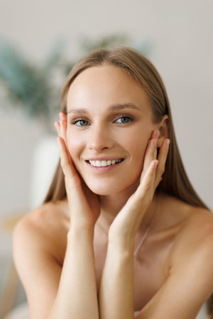 Portrait beautiful young woman with clean fresh skin. Model with healthy skin, close up portrait. Cosmetology, beauty and spaの写真素材