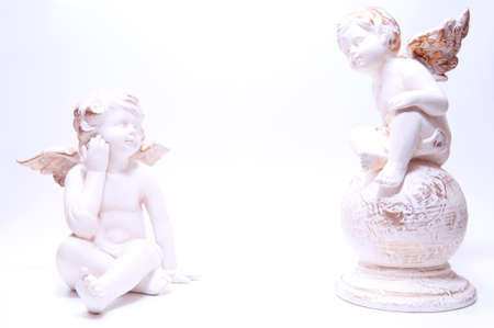 Two angels are sitting in front ofの写真素材