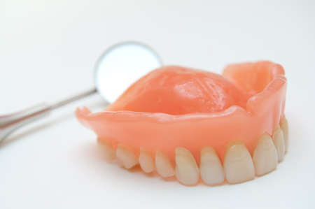 Dentures with a mirror in the backgroundの写真素材